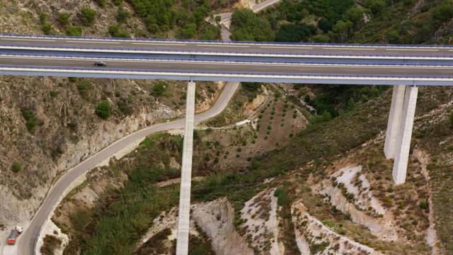 WS AERIAL TS Car travelling along highway over viaduct