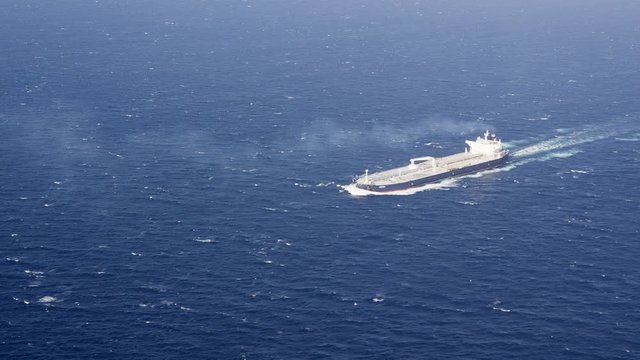 WS AERIAL Fully laden supertanker (VLCC) sailing in sea