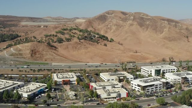 Aerial view of business buildings and freeway in Calabasas, California