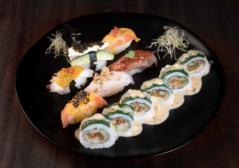 Sushi zuko maki with shrimp, cheese, cucumber and black masago caviar. Homemade dragon roll, japanese food.