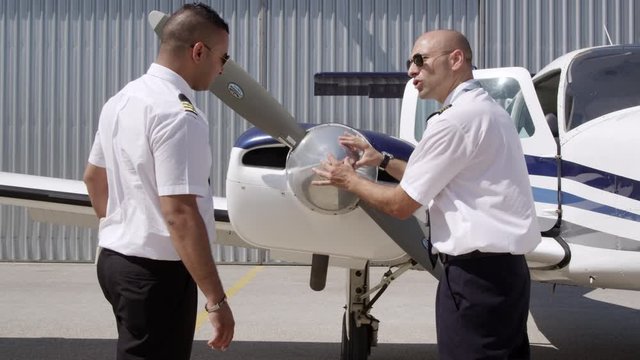 MS Flight instructor and trainee pilot during&nbsp;pre-flight&nbsp;inspection of aircraft