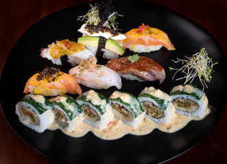 Sushi zuko maki with shrimp, cheese, cucumber and black masago caviar. Homemade dragon roll, japanese food.