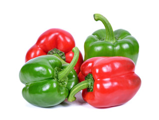 Green and red pepper on white background