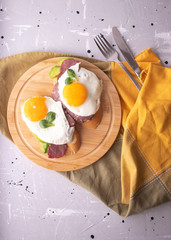breakfast toast with avocado, scrambled eggs and ham