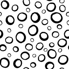 Black and white hand drawn circles vector seamless pattern. Surface pattern design.