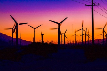 wind turbines at sunset
