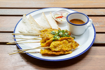 Pork satay - Grilled pork served with peanut sauce or sweet and sour sauce - Asian food style.
