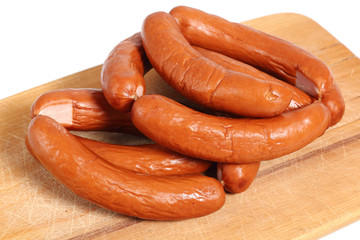Smoked sausages on cutting board