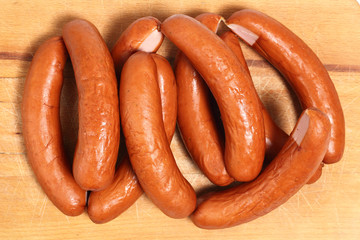 Smoked sausages on cutting board