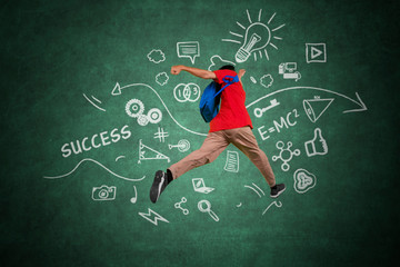 Male college student leaping with doodles