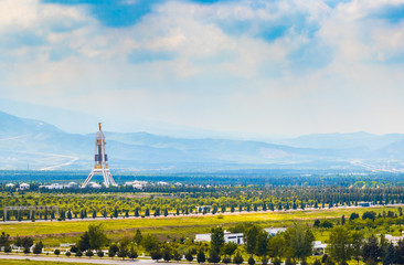 2 May 2020; Monument of Neutrality in Ashagabat, Turkmenistan on a bright cloudy day.