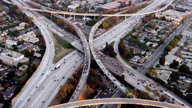 circling aerial view of the I405 and I10 freeway intersection, one of the original 'spaghetti junctions', RED R3D 4K