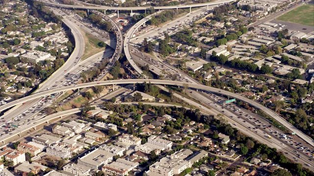 aerial view of the I405 and I10 junction (one of the original spaghetti junctions), then eastbound along I10, RED R3D 4K