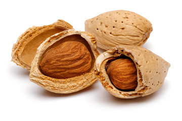 Cracked and whole almonds isolated