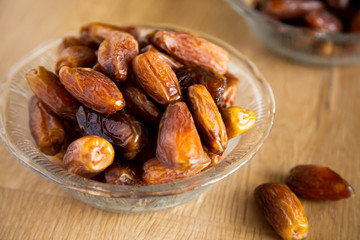 Kurma or dates on wooden background