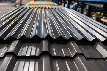 Metal Corrugated roofing profiles in metal roofing factory - obrazy, fototapety, plakaty