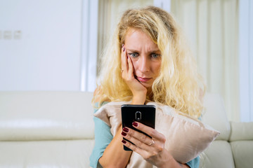 Caucasian woman reading message on cellphone