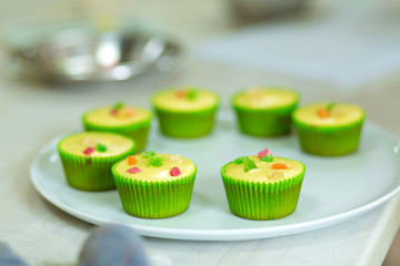 Plate with freshly baked sweet muffins. Sweet pastries, recipes, cooking