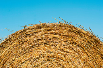 bale of straw abstract background, blue sky
