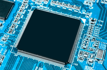 Macro shot of a Circuitboard with resistors microchips and electronic components. Computer hardware technology. Integrated communication processor. Information engineering. Semiconductor. PCB. Closeup