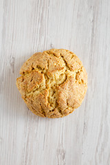 Homemade Irish Soda Bread on a white wooden table, top view. Flat lay, overhead, from above.