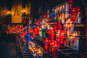 Candles in Montserrat monastery on mountain in Barcelona, Catalonia.