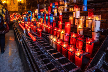 Candles in Montserrat monastery on mountain in Barcelona, Catalonia.