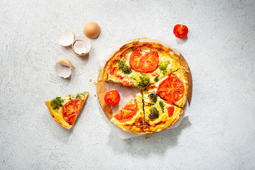 Overhead view of Quiche lorraine with broccoli and cheese