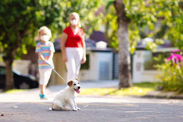 Family walking dog during virus outbreak