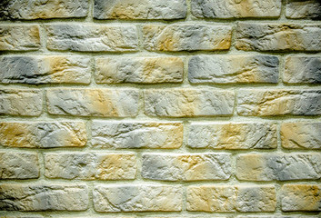 background of dark white brick laid horizontally
