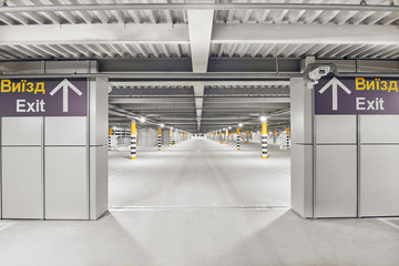 Entrance to underground garage parking. Automobile parking inside.