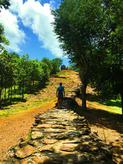 man walking on a stone path