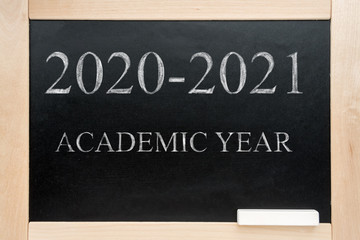 School Board in a wooden frame with the text academic year 2020 2021. Blackboard.