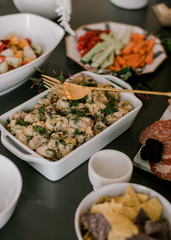 Table spread of  delicious snacks for a house party