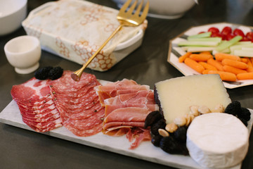 Appetizers table with italian antipasti snacks,  on dark surface