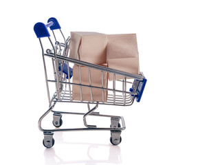Pushcart with boxes isolated on white background. The concept of an online store, online sale, delivery of goods.