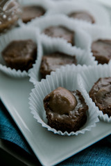 Freshly baked homemade brownies on a white plate