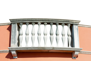 Close-up of a balcony with white stone balustrade and pink wall, isolated on white background