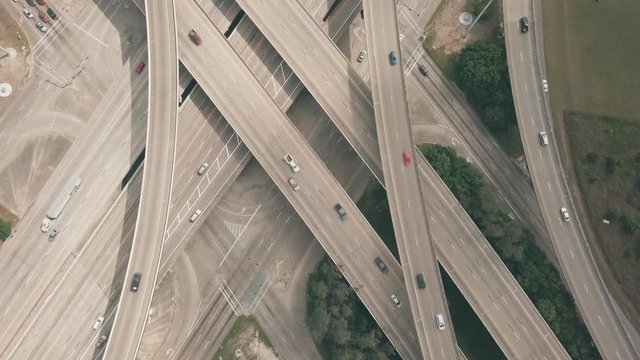 Top Down Descending Aerial View of The Interchange at Beltway-8 and I-69. Bird's Eye Shot of a Multi-level Stack Interchange in Houston.