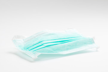 Green protective mmedical, surgical face masc COVID-19. on white background