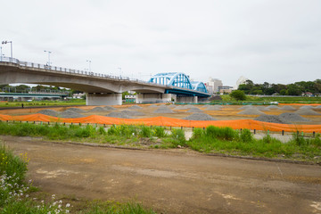 Obraz premium 災害後の河川敷補修工事現場