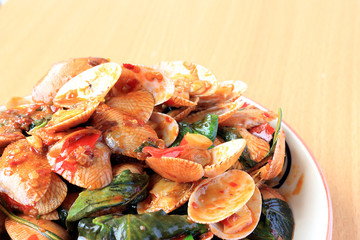 Stir fried striped clams with basil, chilli paste, garlic and fresh chilies