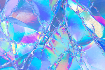 Blurred abstract Modern pastel colored holographic background in 80s style. Crumpled iridescent...