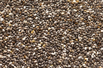 Chia seeds close-up background macro. The texture of the Chia seeds. Copy space. Flat lay. Healthy food from Chia seeds.
