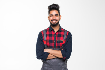 Fototapeta premium Portrait of smiling indian man worker in blue uniform isolated on white background