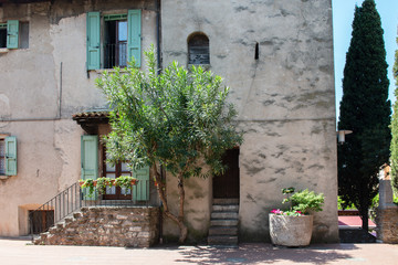 Fototapeta na wymiar Street in Sirmione, small ancient picturesque town on Lake Garda, Italy
