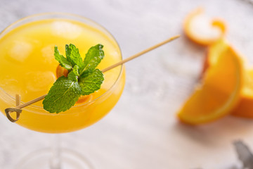 Close up of cocktail garnish. Famous Spanish drink Agua de Valencia, mix of cava, orange juice, vodka and gin.