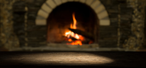 image of wooden table in front of abstract blurred background of resturant lights