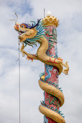 Fototapeta premium chinese dragon climb on polePs.public Domain