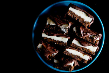 Chocolate bars with mint, chocolate shortbread crust and melted chocolate 